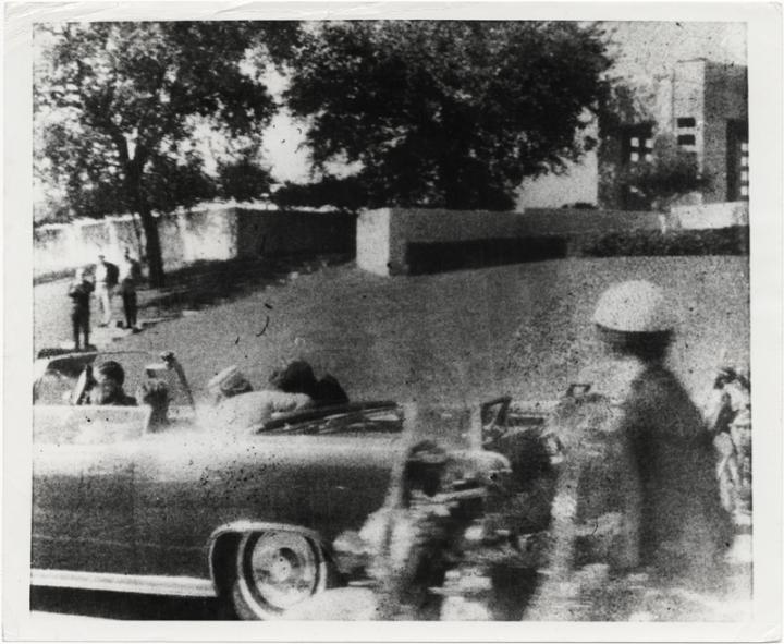 A shot of the JFK motorcade after he was assassinated. 