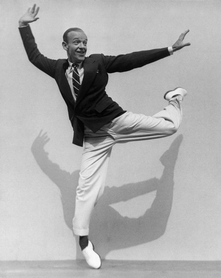 A man posing to perform a pirouette.