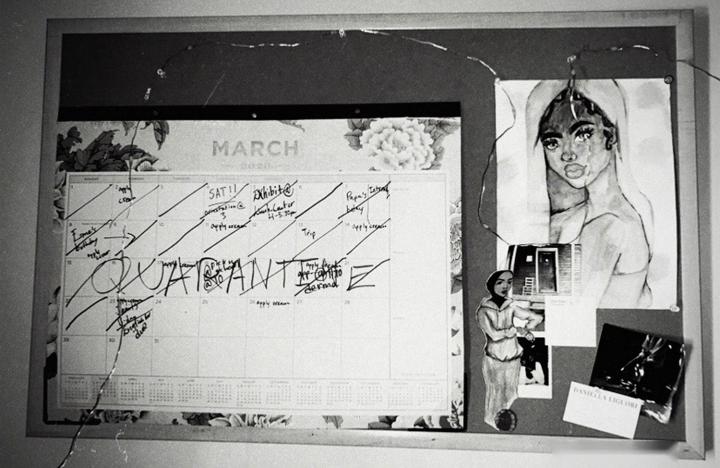 A March calendar half crossed out, with the word QUARANTINE written over the third week.