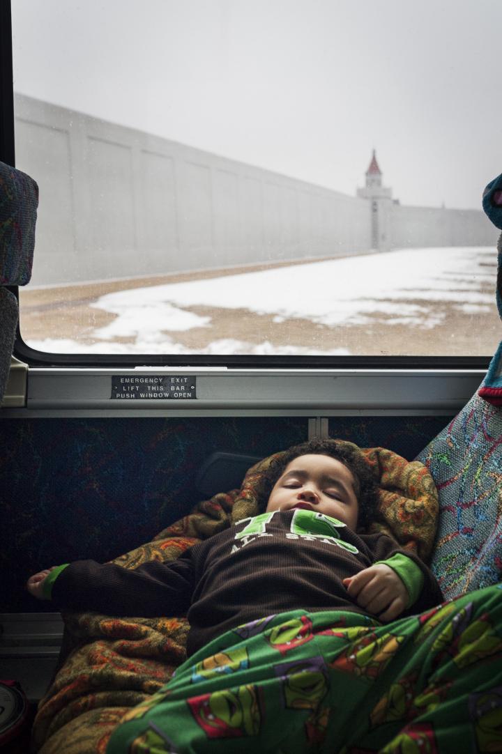 Child sleeping on bus