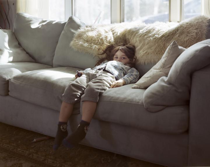 Child laying on couch