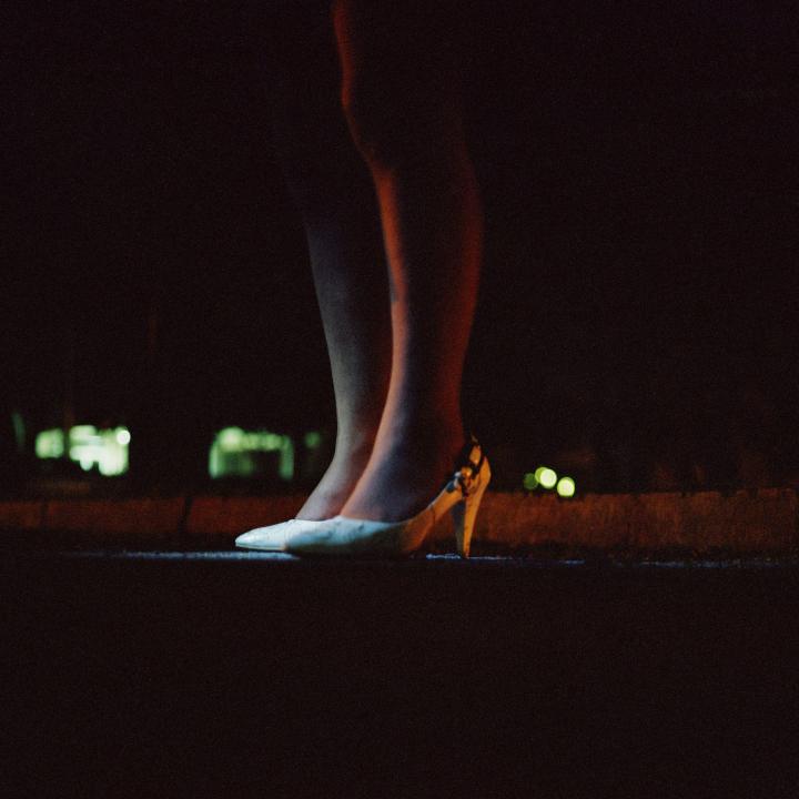 Image of the legs of a lady wearing heels