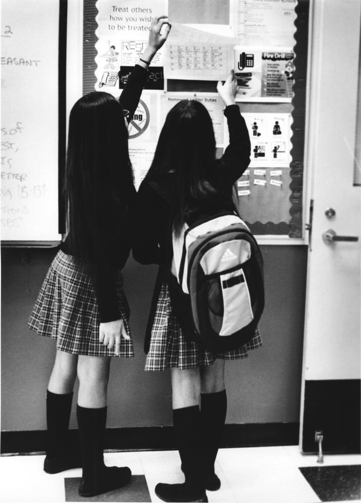 Black and white image of 2 school girls