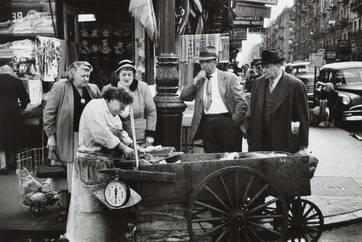 Old image of a lady selling fish in the streets