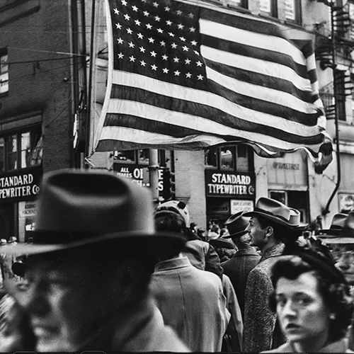 An old photo of people outside.