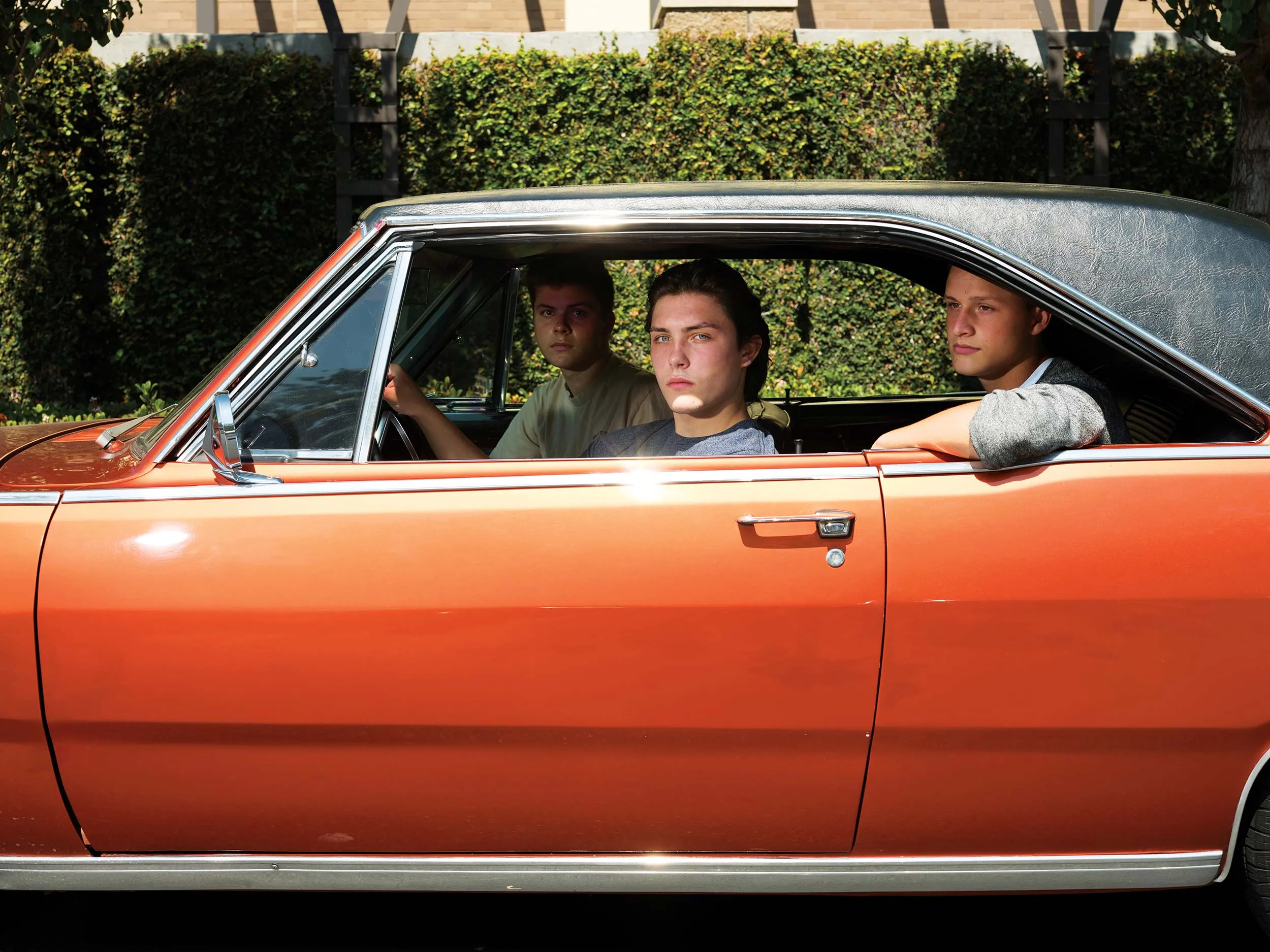 Three men in a car.