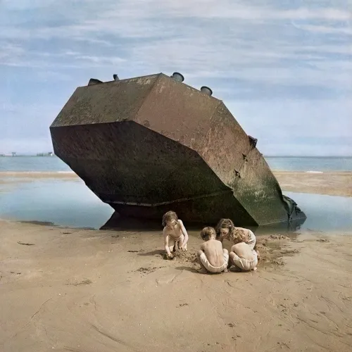 Four kids playing at the beach.
