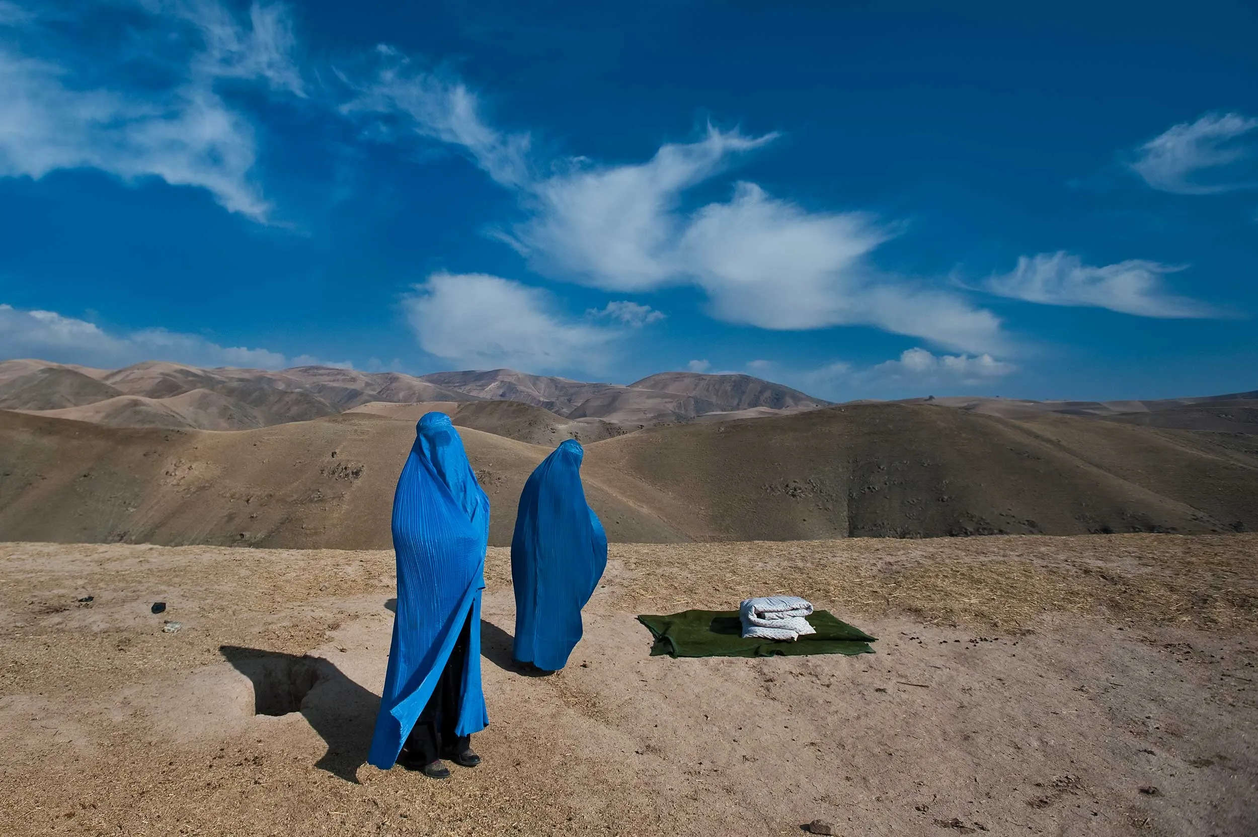 Two people standing outside.