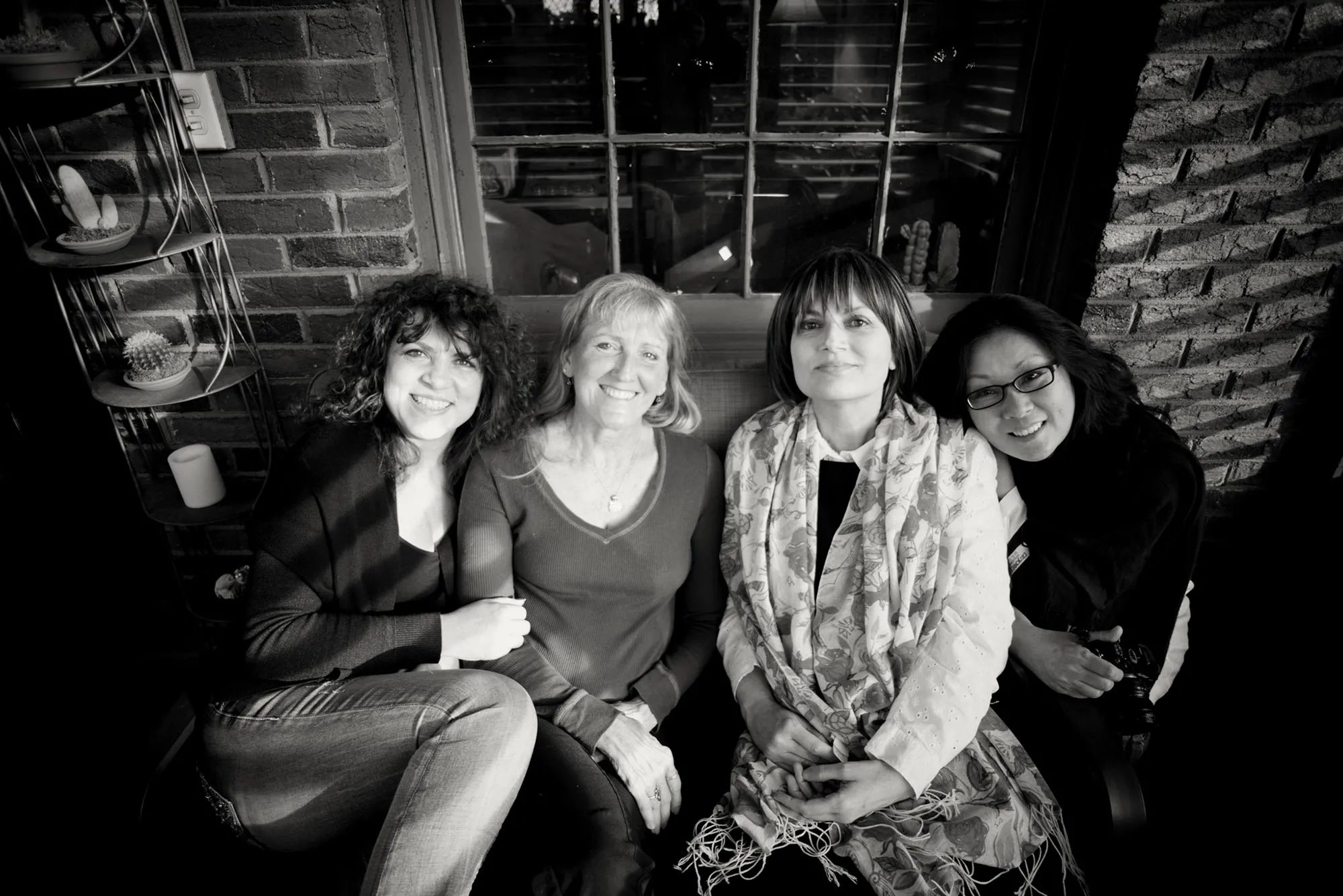Four women sitting down.