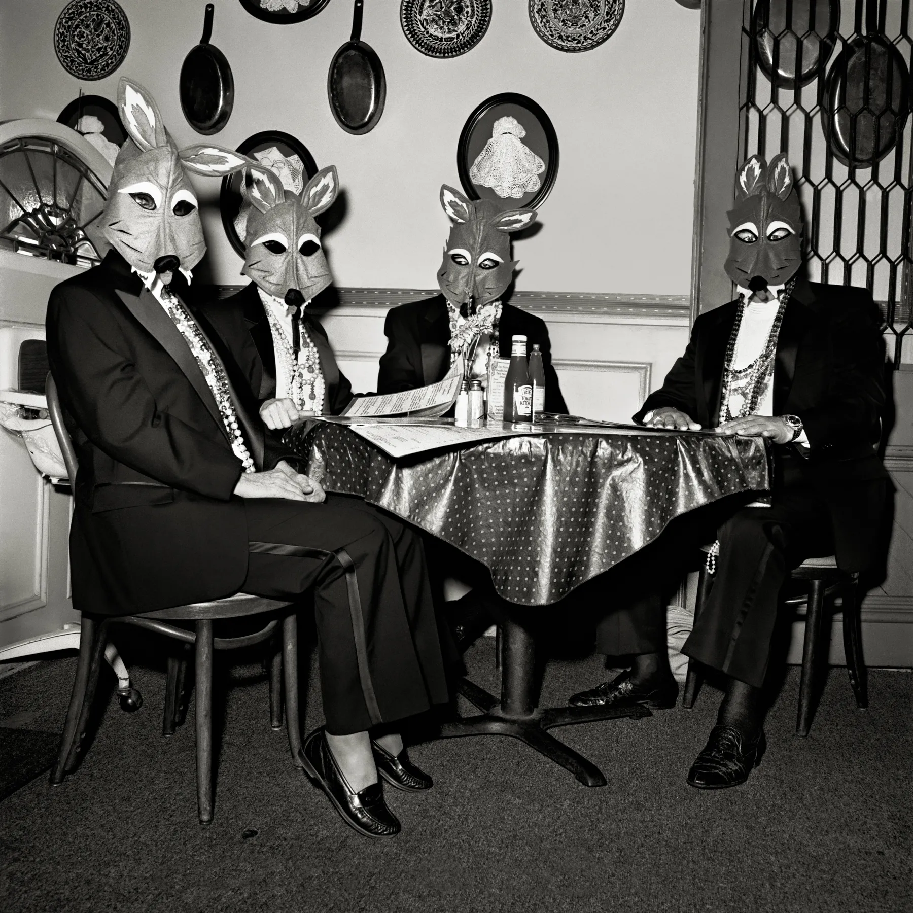 A group of people wearing animal mask.