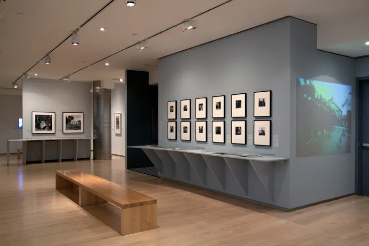 An exhibition featuring two perfect rows of black and white photographs.