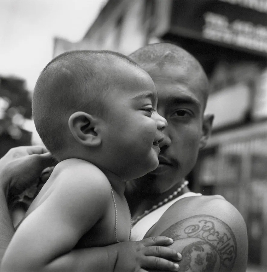 A man holding a baby.