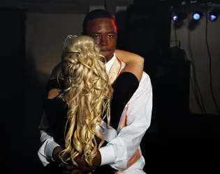 Two people dancing at a party.