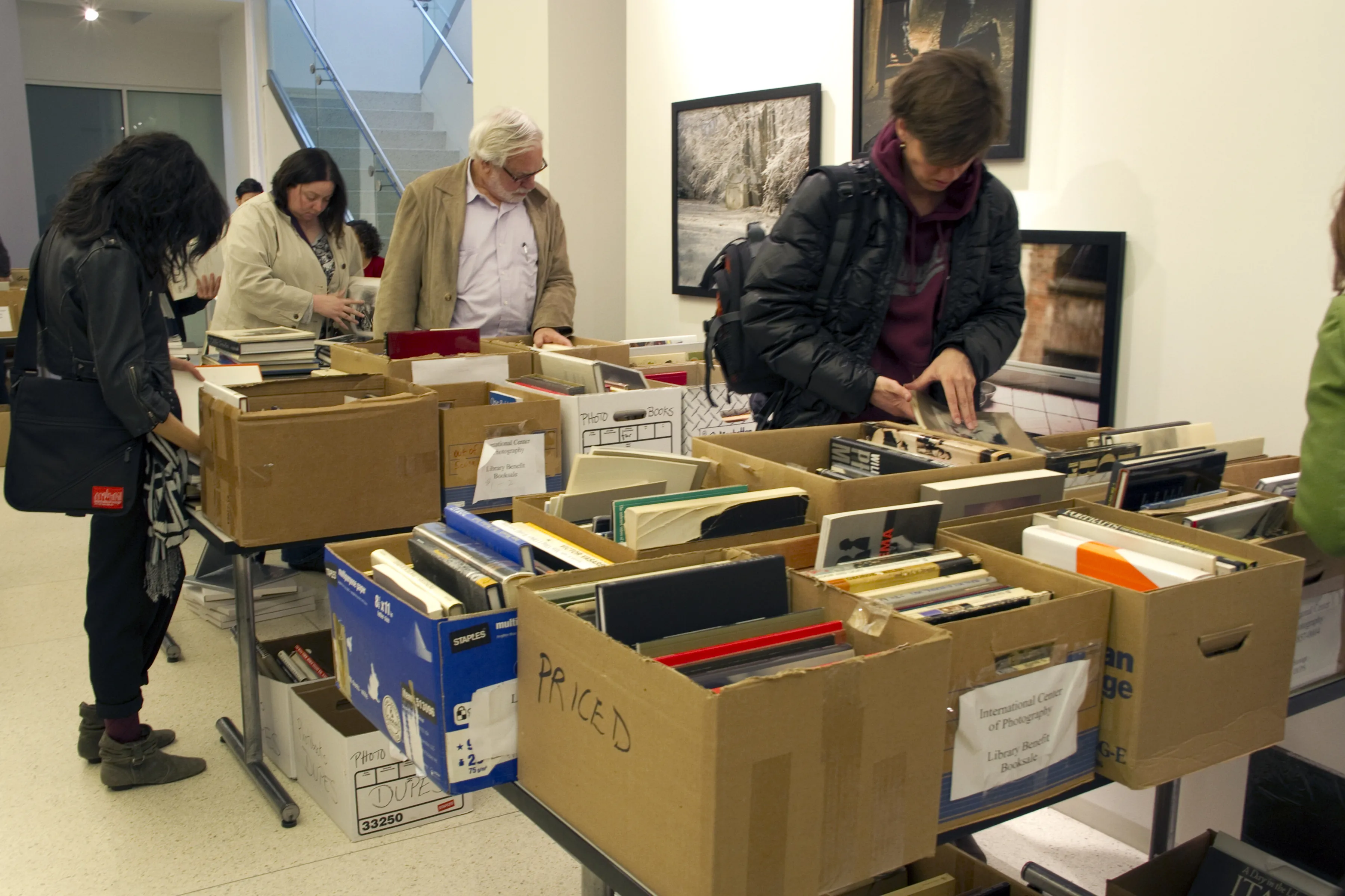 People looking through boxes.