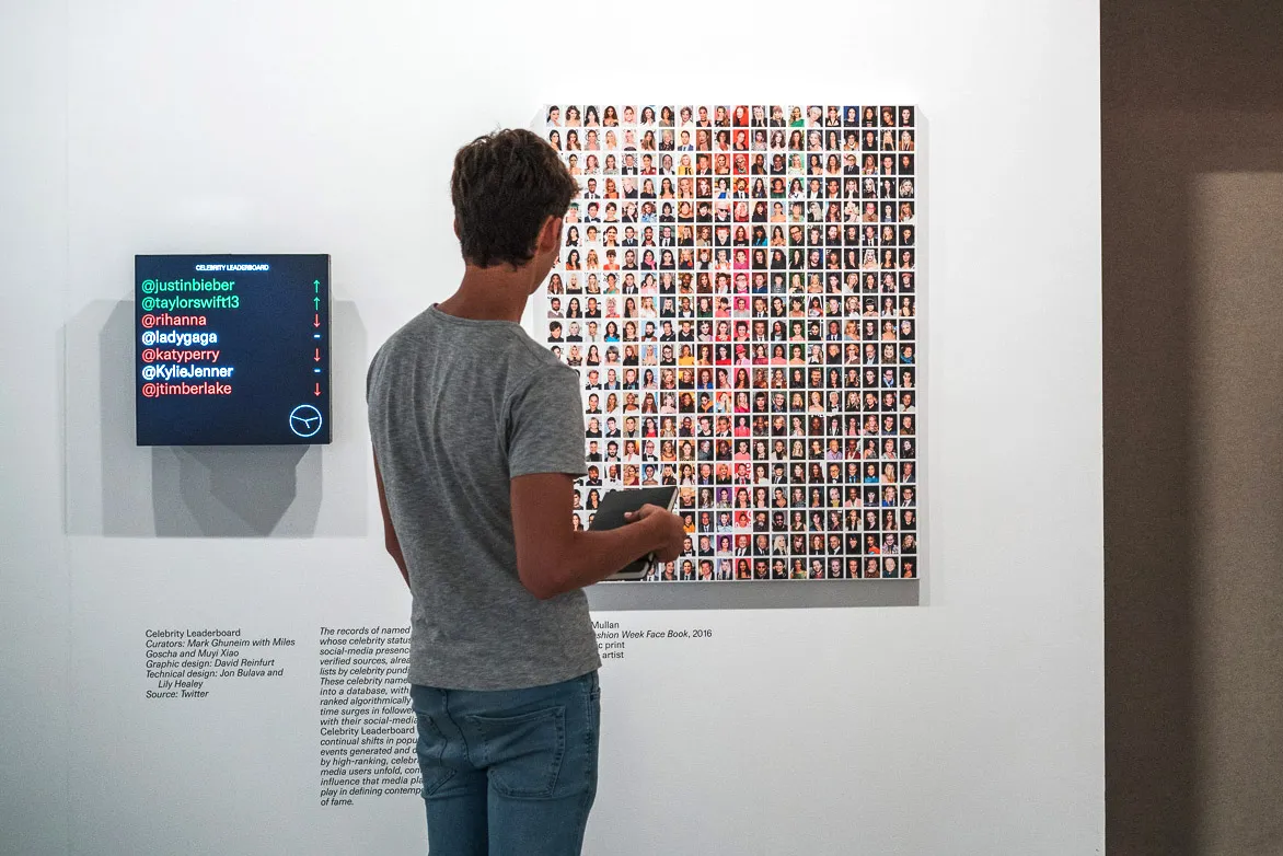 Man looking at art exhibit
