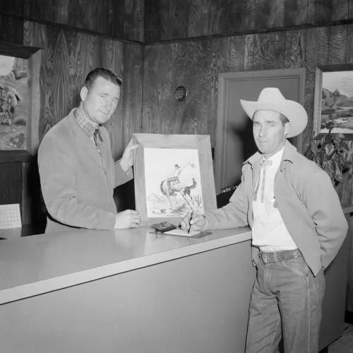 A man buying an art piece.