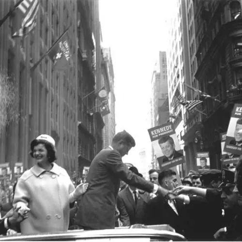 JFK and Jackie O shaking hands with supporters.