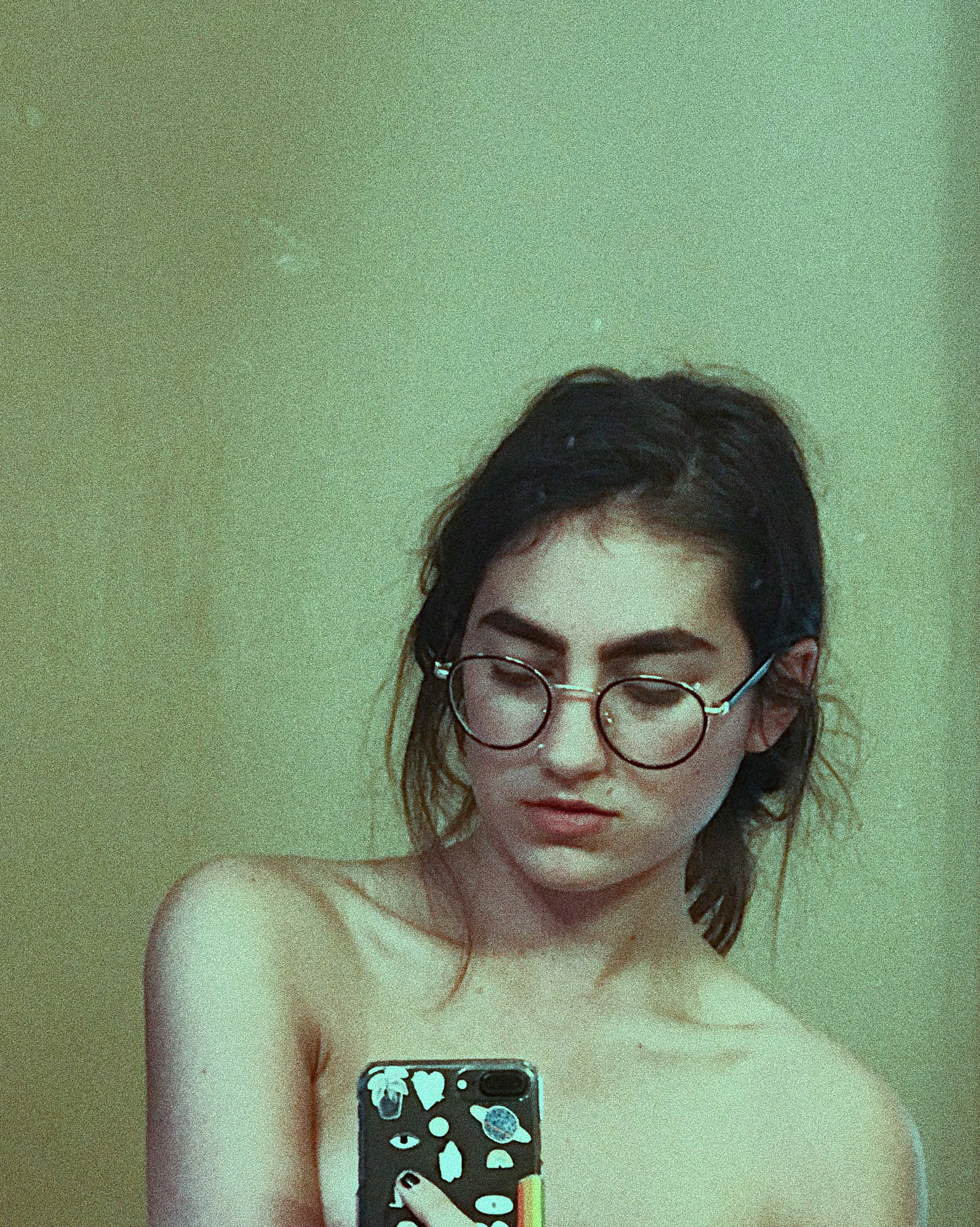 A woman taking a selfie.