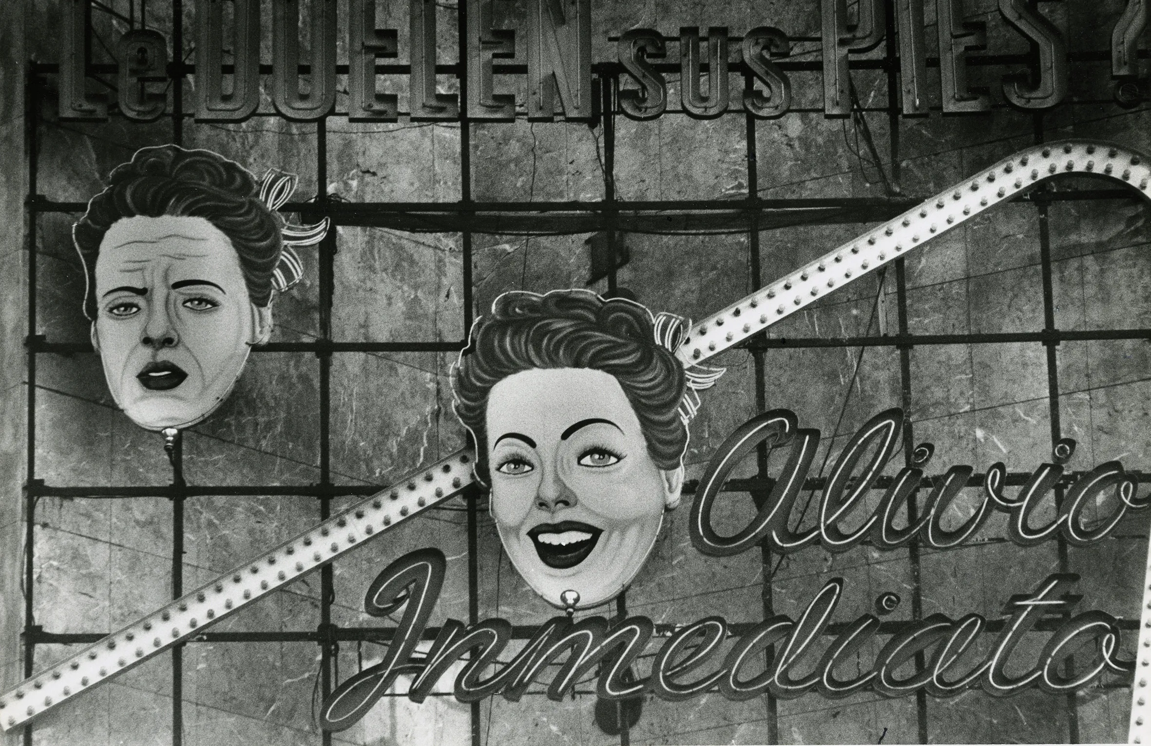 Two faces on a billboard.
