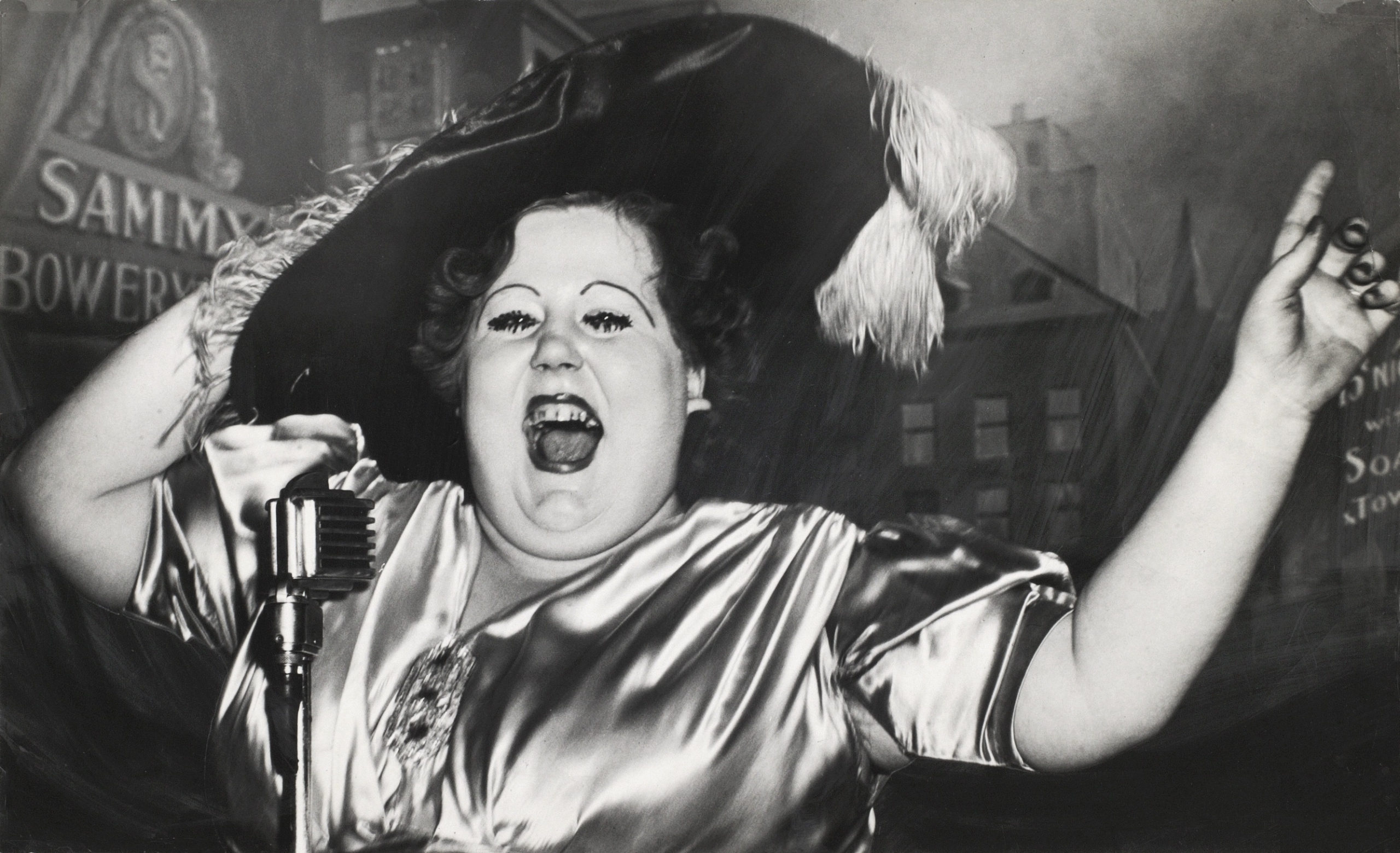 Weegee, Norma Devine, the Mae West of Sammy’s, December 4, 1944, © International Center of Photography.
